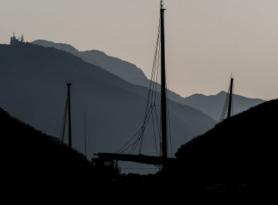 Masts of Chinese sailing junk in silhouette