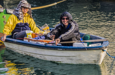 Couple fishing off the bow of Watermark, Aberdeen Typhoon Shelter, Hong Kong Island