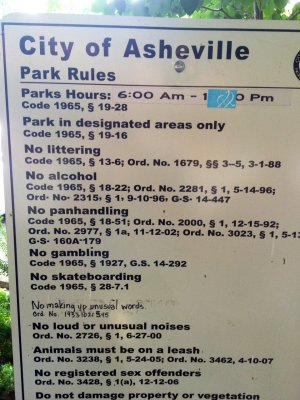 Hipster-defaced park rules sign