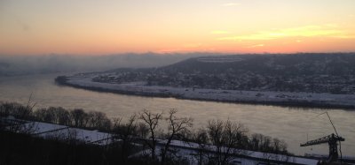 Sunrise over a high river