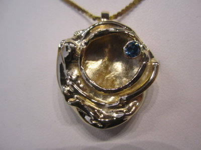 14k water cast with swiss blue topaz