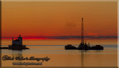 Oswego, New York's Lighthouse With  Dredging Barge  