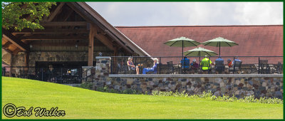 People Enjoy A Leisure Meal Or Drink On This Beautiful Patio