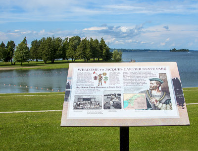 A Welcome To Jacques Cartier State Park Sign Overlooking The Campground's Beach