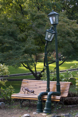 Street Lamps Sitting on a Park Bench