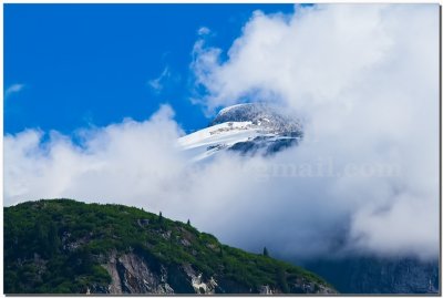 IMG_5668.jpg On the way to Tracy Arm (Is it a bird peeking from the clouds?)