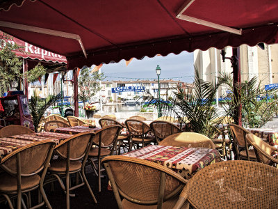 Empty cafe tables- Port Grimaud