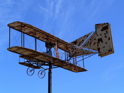 Rusty airplane sculpture in the sky