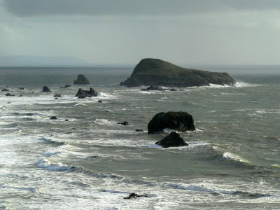 Rainbow Rock among November surf