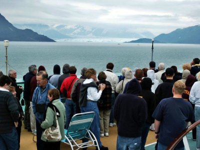 Passengers look at approaching glacier field