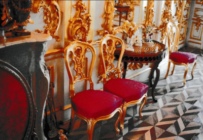 Gilded red chairs and decorations