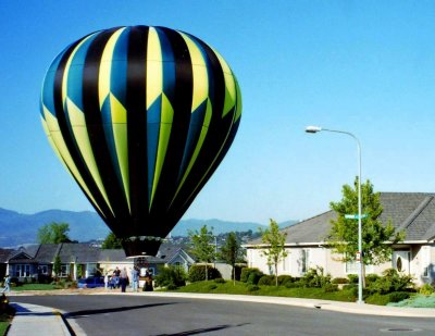 Hotair balloon lands in neighborhood