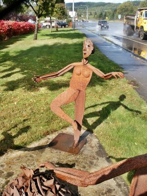 Iron sculpture stands on one foot