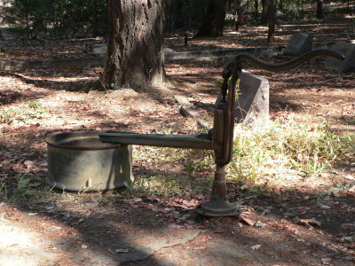 Hand water pump in Logtown cemetery