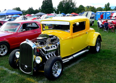 A yellow Ford hot rod