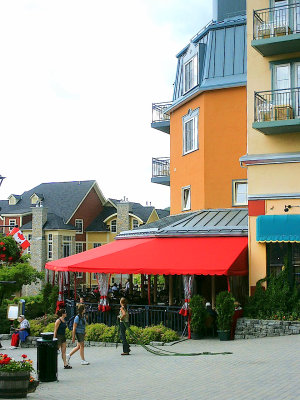 Quebec Tremblant Village lady doing her watering_1.jpg