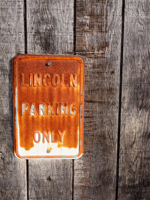 Well,if you had a lincoln,  you probably could afford a better sign.