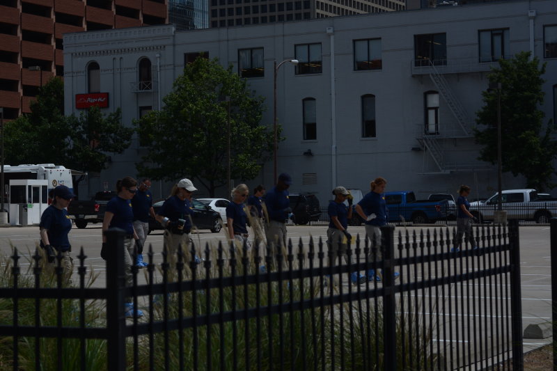 FBI agents doing sweep of crime scene