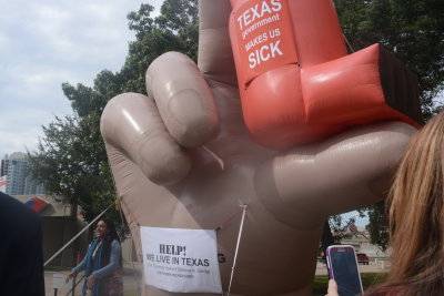 Giant Hand and InHaler Symbolic of Poor Air Quality in Major Portions of the more Populated Parts of Texas