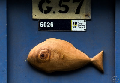 Wooden fish blowing bubbles.