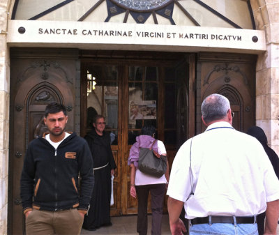 Fr David at the entrance of the Church of St Catherine in the Basilica of the Nativity