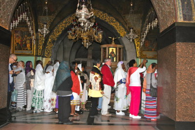 Multicultural line to Orthodox altar. 