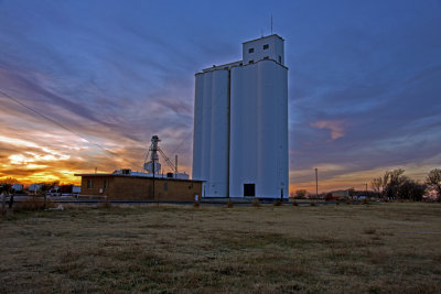 Dacoma, OK grain elevator at sunset.