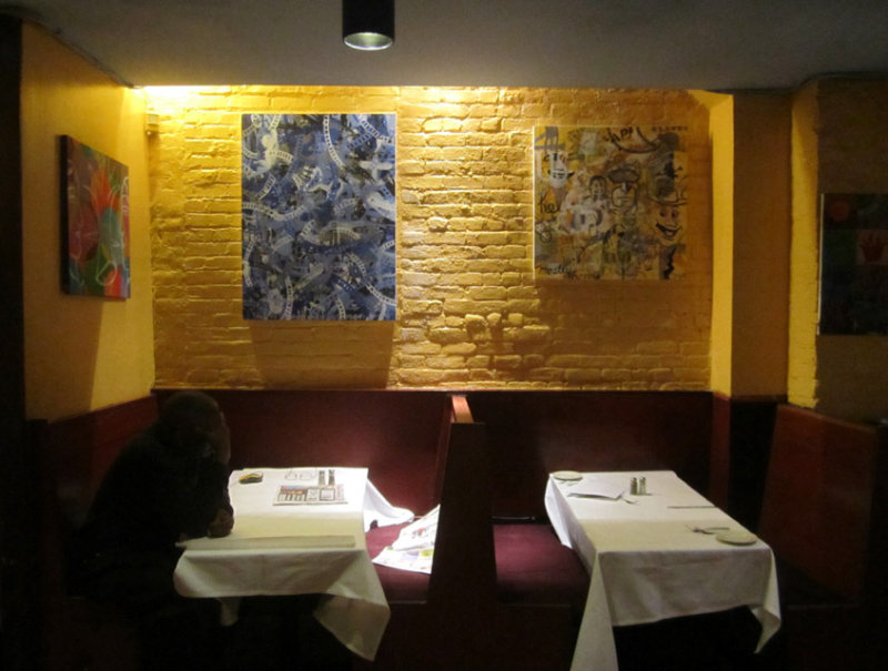 Man Contemplating Original Paintings.jpg
