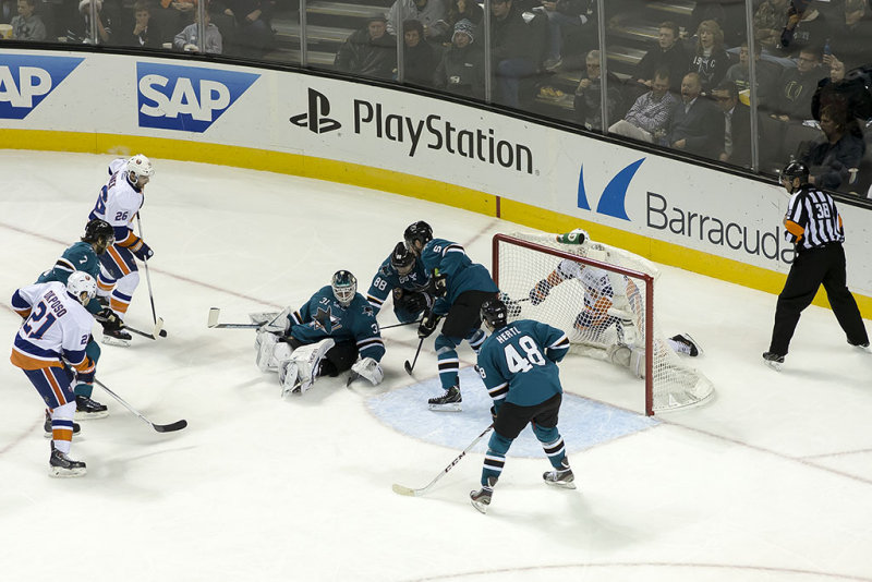 Thomas Vanek's shot gets past Antti Niemi and Brent Burns desperately tries to keep it out of the net