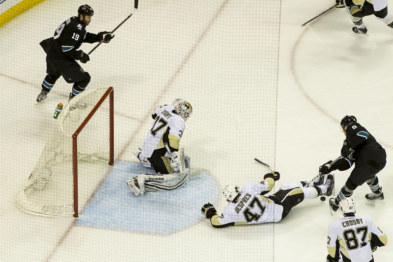 Simon Despres blocks a shot from Joe Pavelski