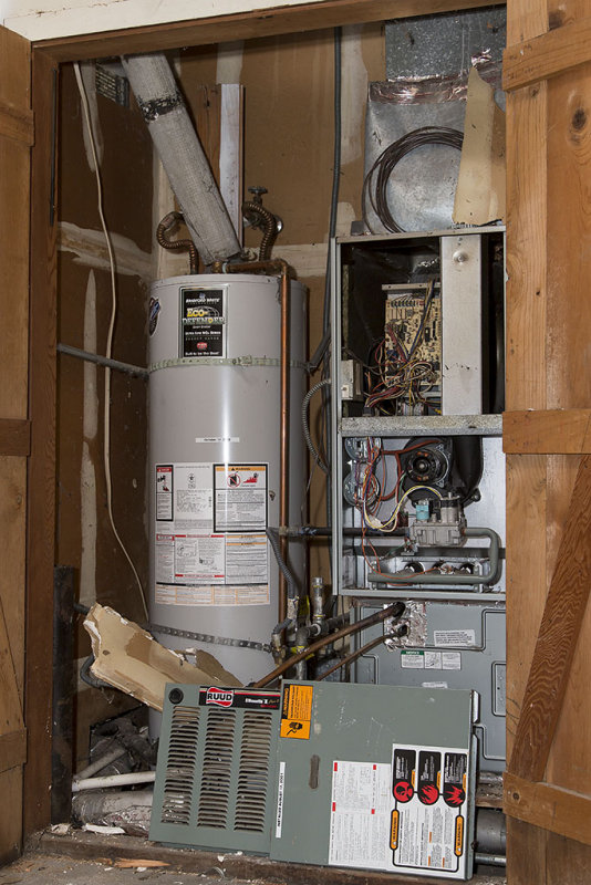 Old furnace  RUUD Silhouette II Plus 2 Two-Stage 80-Percent Downflow Premium Gas Furnace