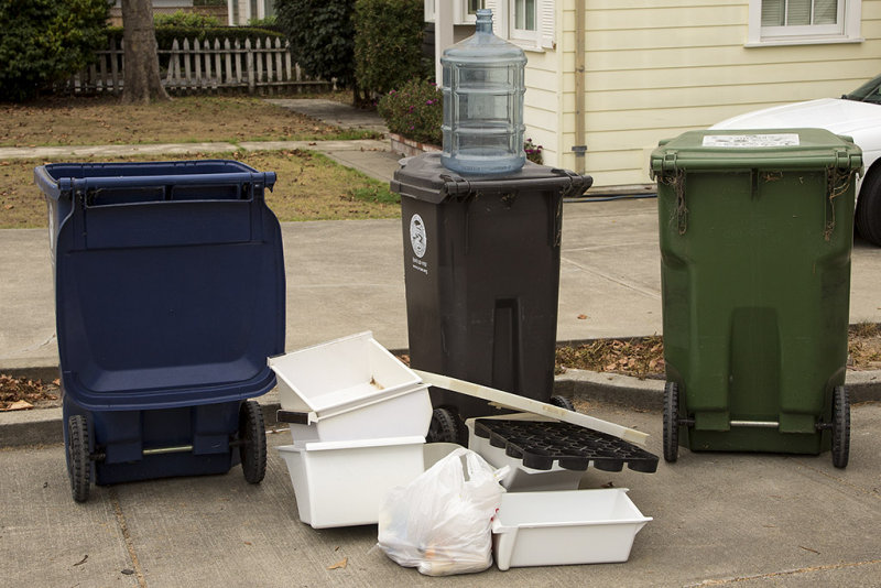 Somebody is filling my recycling and garbage cans with their garbage