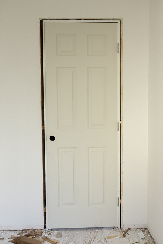 Masonite 28 in. x 80 in. Textured 6-Panel Hollow Core Primed Composite Single Prehung Interior Door