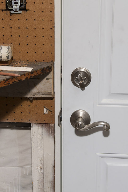 Kwikset Lido lever and 980 series deadbolt in Satin Nickel