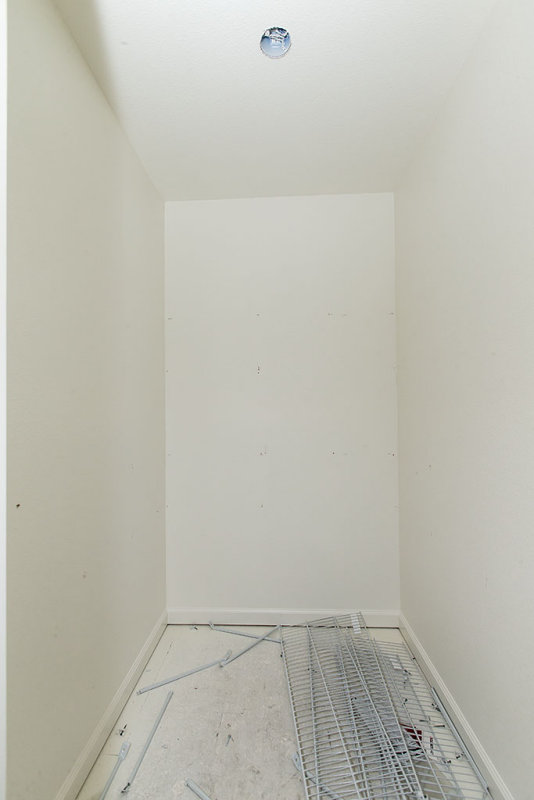 Master bedroom closet minus wire shelves