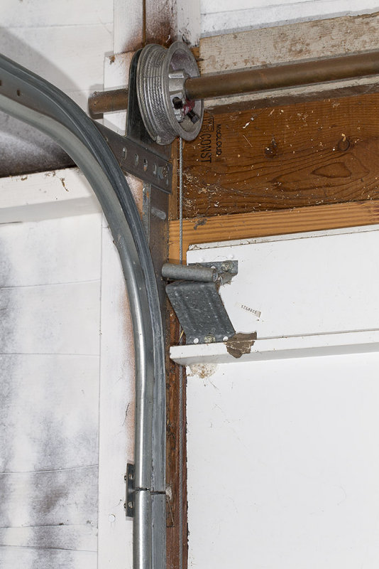 Garage door hardware needs replacement or repair