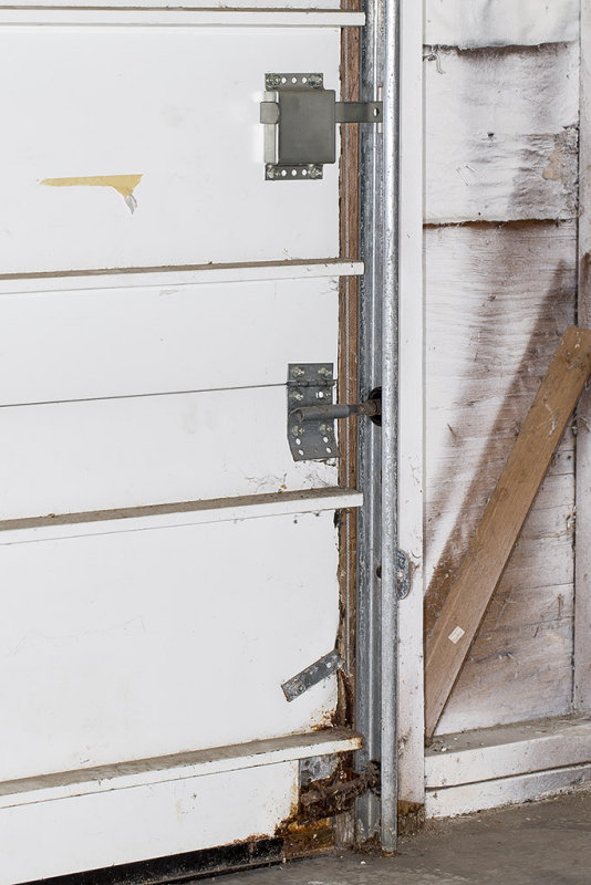 Garage door hardware needs replacement or repair