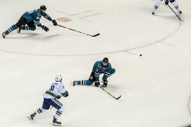 Paul Martin trying to block a shot by Markus Granlund