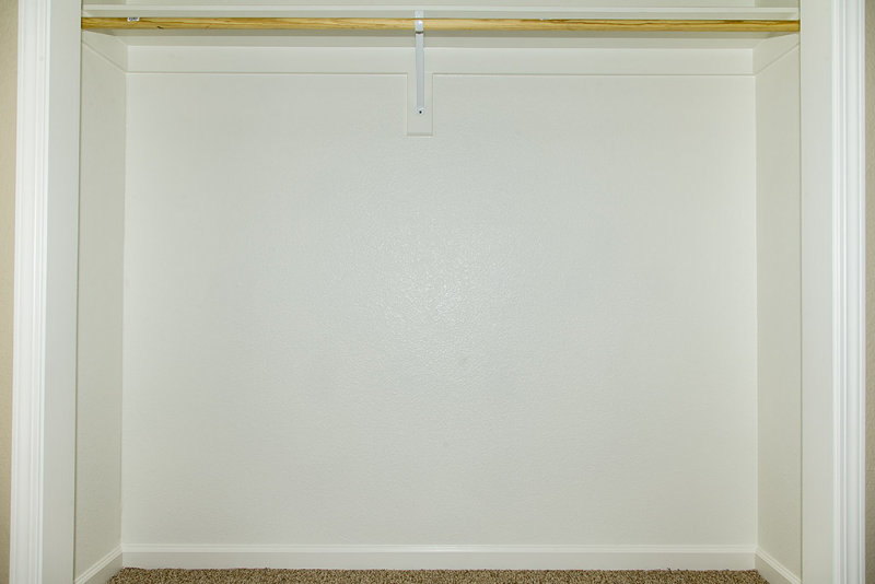 Bedroom 2 closet with holes filled and painted