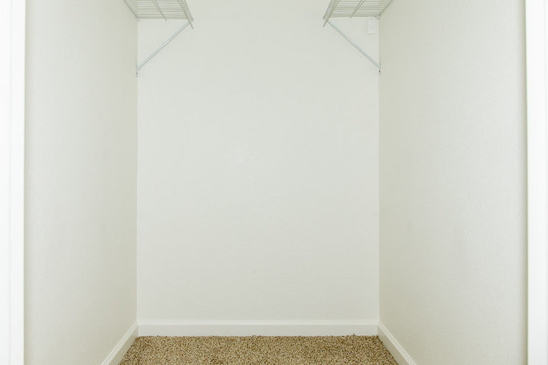 Master bedroom closet with holes filled and painted