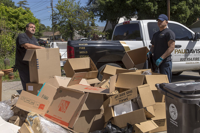 Picking up the boxes and garbage