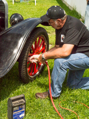Checking the tire pressure.