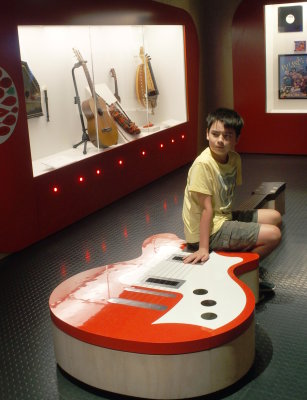Charlie and a large guitar