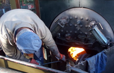Stoking the fire box in the steam tram