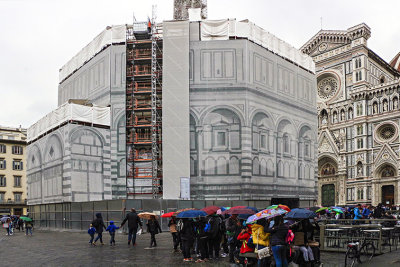 IMG_3976 Baptistery under wraps  and  visitors with umbrellas.jpg