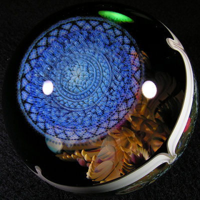 An amazing icy Rose Roads disc sits on top of the lens.