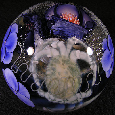 Sooo AWESOME, with the hilarious juxtaposition of sweet blue flowers all around!
