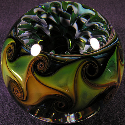 This marble was created by Paul and includes a sweet section by Doug inside of the marble.