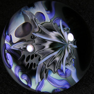 This is a super rare marble where John put one of his jellyfish on top of a Snoddy skull!