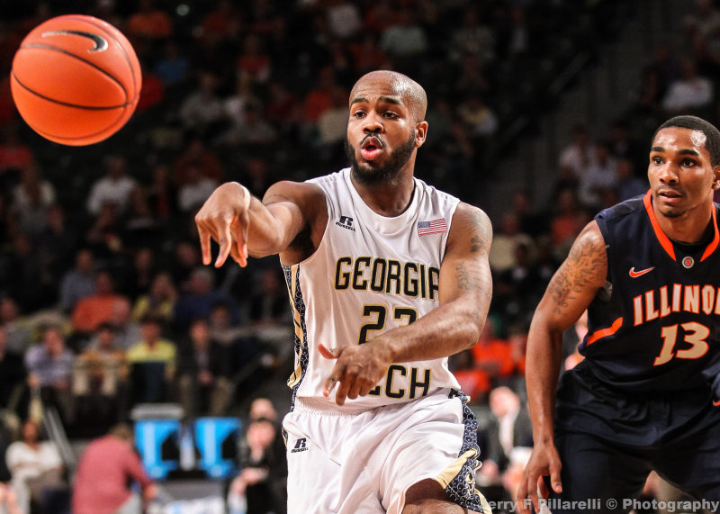 Yellow Jackets G Trae Golden fires a pass to a teammate